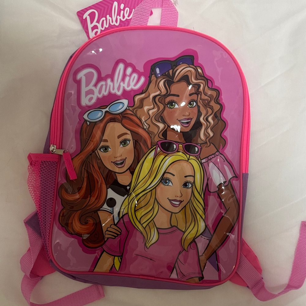 Barbie Pink Backpack with adjustable straps and mesh side pocket.